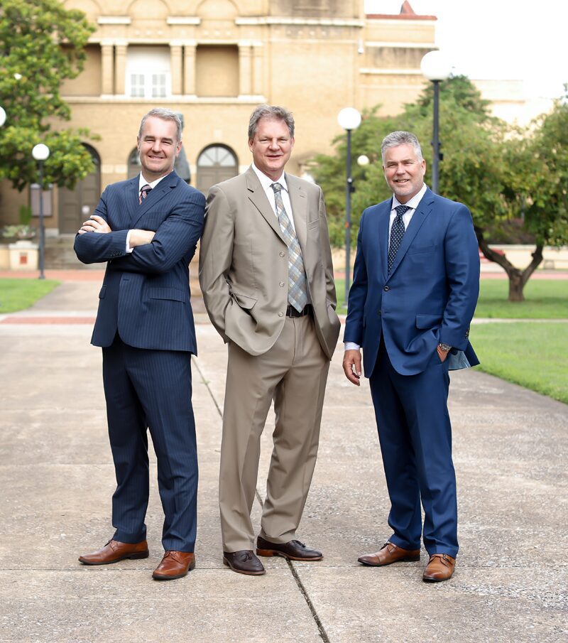 Howerton, Dorris, Stone, Lambert attorneys standing outside